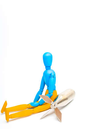 Wooden doll of Ukrainian flag colors, on gray backgroundの写真素材