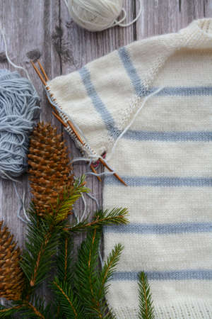 Striped baby sweater made of high quality woolen yarnの写真素材