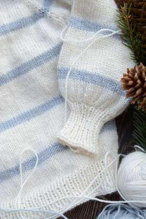 Striped baby sweater made of high quality woolen yarnの写真素材