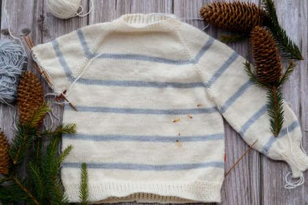 Striped baby sweater made of high quality woolen yarnの写真素材