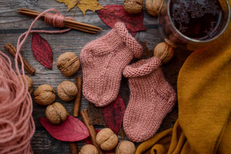 small soft handmade socks on wooden backgroundの写真素材