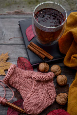 small soft handmade socks on wooden backgroundの写真素材