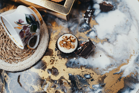 Various small chocolate candies on vintage backgroundの写真素材