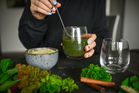 Making healthy green cocktail, in the kitchenの写真素材