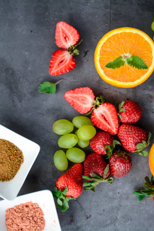 Fresh fruits on a dark background, top view, copy space.の写真素材