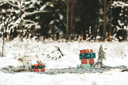 Christmas and New Year background. Christmas tree and gifts in the winter forestの写真素材