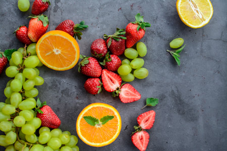 Fresh fruits on grey background, top view. Healthy food concept.の写真素材