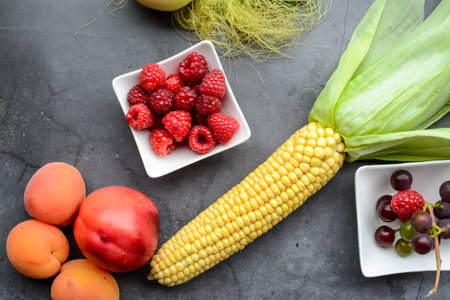 Fresh fruits and vegetables on a gray background. Selective focus.の写真素材