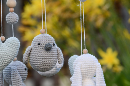 Handmade knitted toys in the form of a bird and a rabbitの写真素材