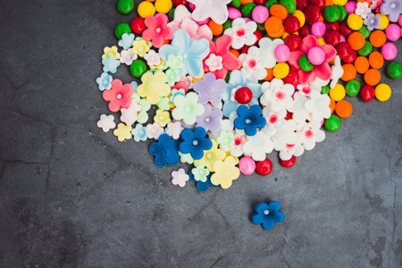 Colorful confetti in the shape of a heart on dark backgroundの写真素材
