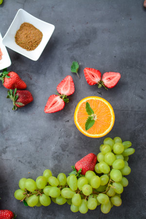 Fresh fruits and berries on a dark background. Healthy food concept.の写真素材