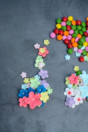 Colorful candies on grey stone background. Selective focus.の写真素材