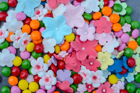 Colorful candies on grey background, top view.の写真素材
