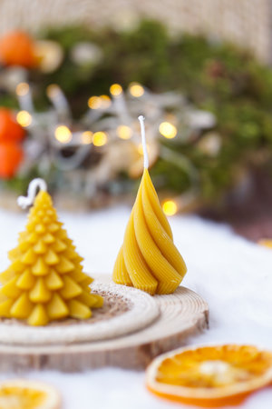 christmas decoration with candles, fir tree and tangerines on snowの写真素材