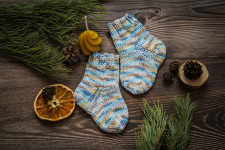 Warm knitted socks on a wooden background. Christmas decoration.の写真素材