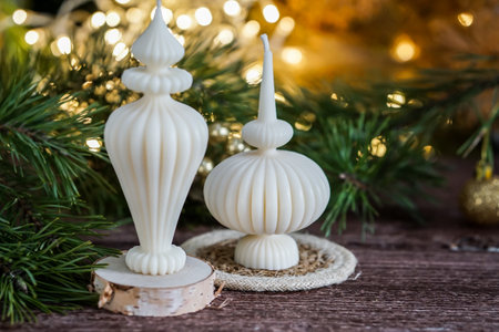 Christmas decoration with candles on a wooden background. Selective focus.の写真素材
