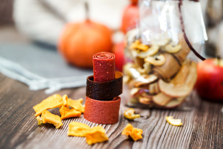 Freshly rolled, homemade fruit leather and dried fruit slices made from organic ingredients are...