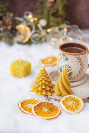 Christmas still life with cup of hot chocolate, candles and dried orangesの写真素材