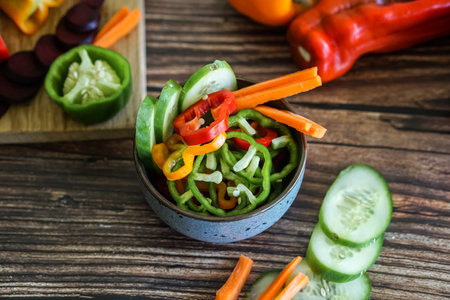 Vegetable salad in a bowl on a wooden table. Selective focus.の写真素材