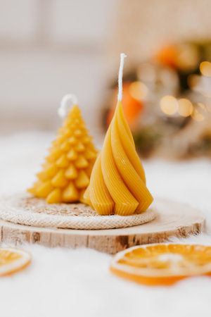 Christmas candles in the shape of a Christmas tree on a wooden backgroundの写真素材