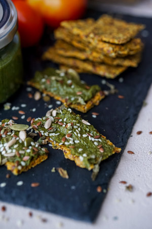 Healthy vegetarian crackers with chia seeds, pumpkin seeds, sunflower and sesameの写真素材