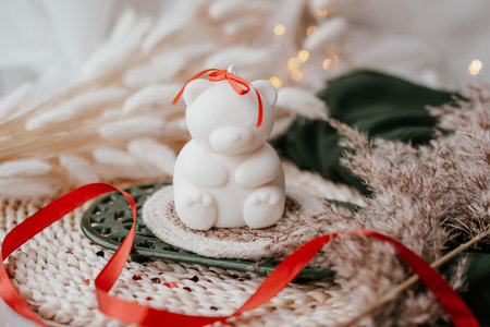 Soy wax candle on wooden table, bokeh backgroundの写真素材