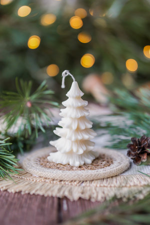 Soy wax candle on wooden table, bokeh backgroundの写真素材