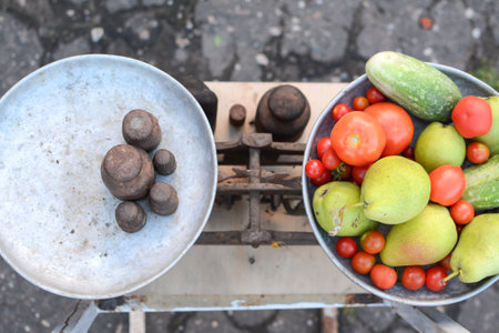 Fruits and vegetables in the old scales on the street.の写真素材