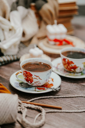 Cup of hot chocolate on a wooden table in the garden.の写真素材