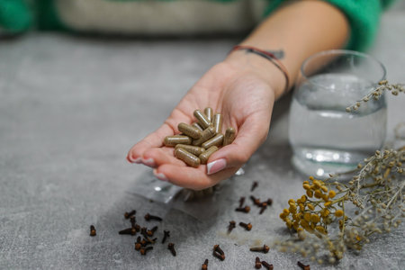 Herbal medicine in a woman's hand. Close-up.の写真素材