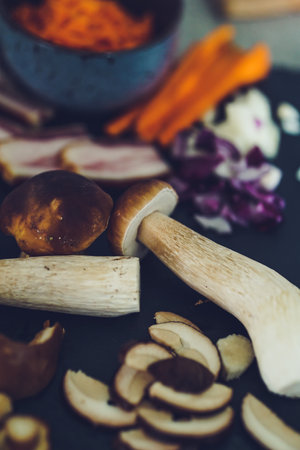 Mushrooms and vegetables on a black background. Selective focus.の写真素材