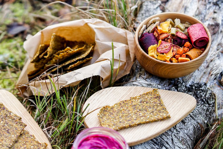Healthy food in a wooden bowl on a background of birch barkの写真素材