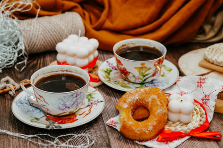 Two cups of coffee and donuts on a wooden table. Breakfastの写真素材