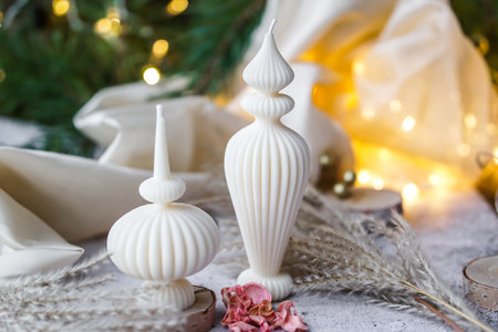 Christmas decoration with candles on a light background. Selective focus.の写真素材