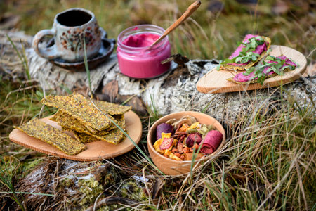 Dried fruits and vegetables on a wooden table in the forest.の写真素材