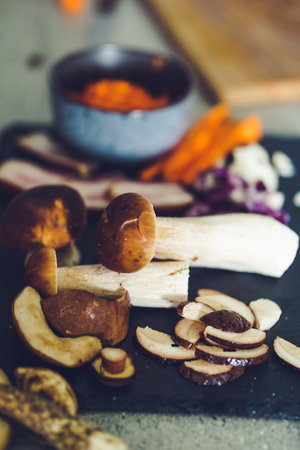 Mushrooms on a black plate, selective focus, vintage styleの写真素材