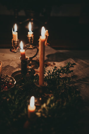 Vintage christmas still life with candles on wooden table. Selective focus.の写真素材
