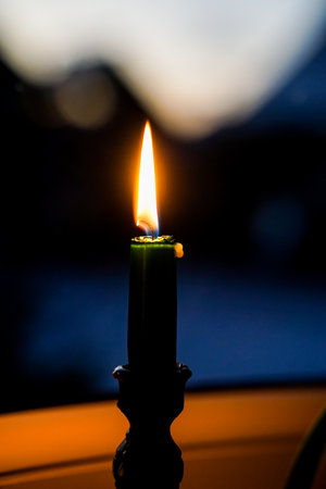 Candle light in the dark, close up shot with shallow depth of fieldの写真素材