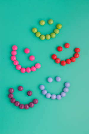 Lots of colorful and variegated candy background, green. Pleases children, creates a happy mood and makes you smile. Sweets wallpaper, fun for phone or computer.の写真素材