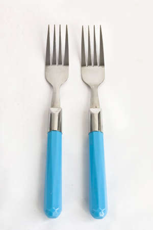 Forks  with plastic handler on white background.の写真素材