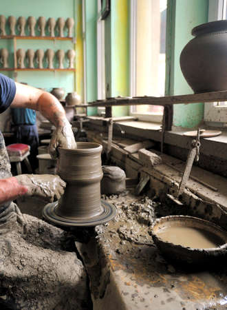 The potter's wheel. The potter's used potter's wheel for modelling new clay pots.