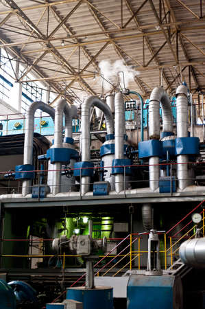 Thermal power plant interior architecture. Pipes system for transporting the hot water produced by...