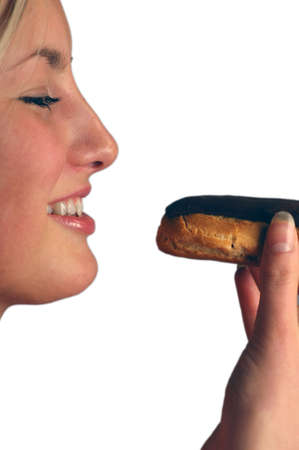 Model eating cream pastryの写真素材