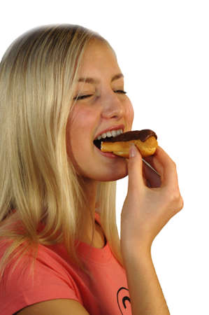 Model eating cream pastryの写真素材
