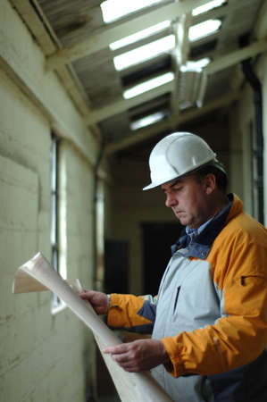 Male 40's wearing safety hard hatの写真素材