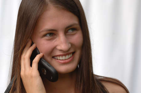 Attractive Teen Fashion Model on mobile phoneの写真素材