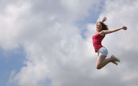 Very Attractive Teenager Jumping for Joyの写真素材