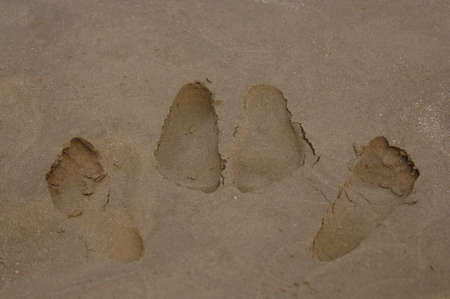 Naughty Footprints in the sandの写真素材
