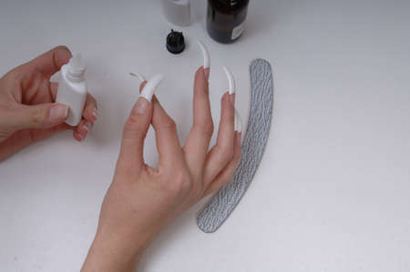 Acrylic Nails and Neatly Manicured Fingernailsの写真素材