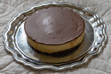 Very tasty homemade pumpkin cake with chocolate on a tray. Top view. With copy space for text